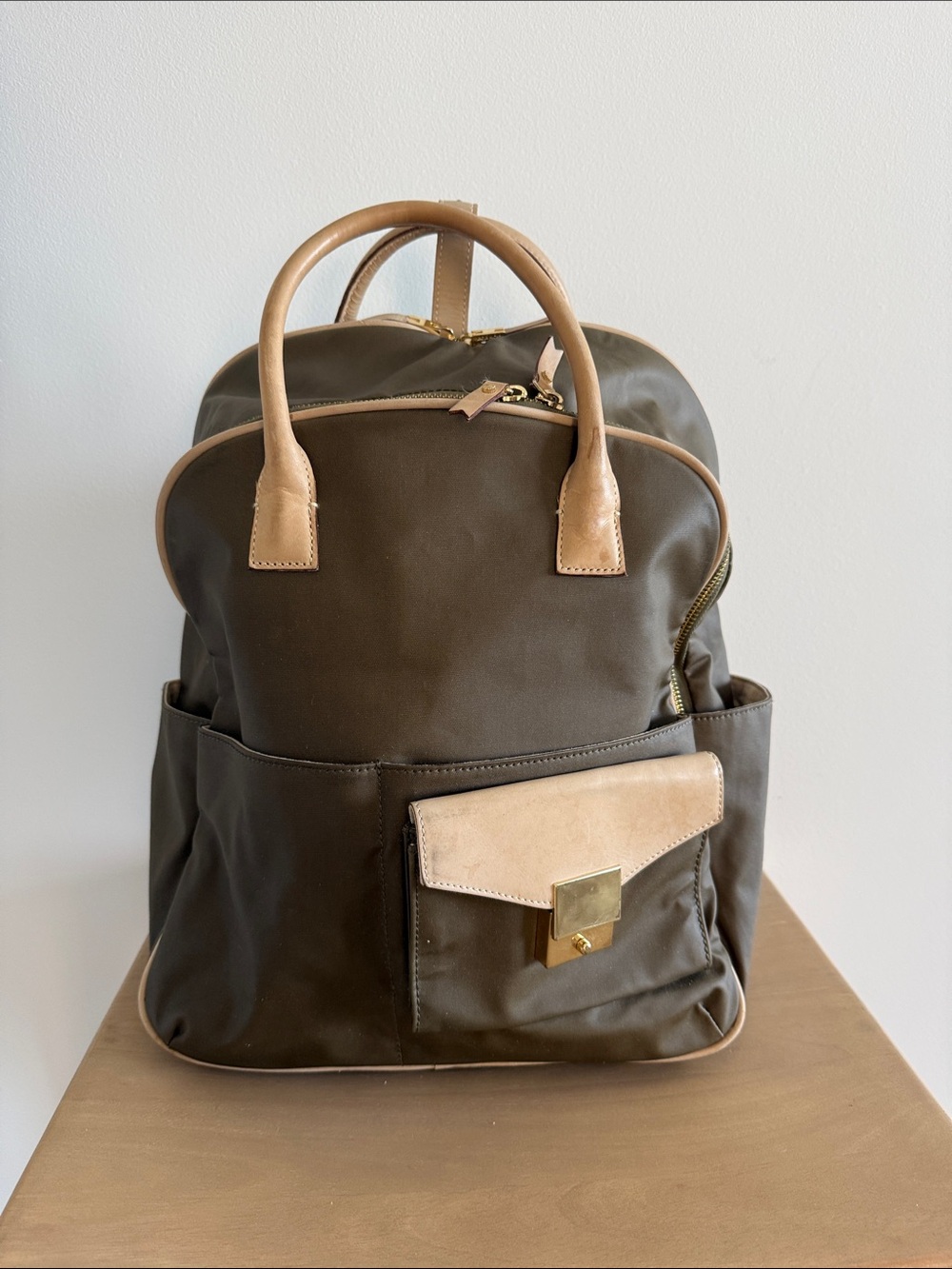 India Hicks olive back pack with tan leather and gold hardware